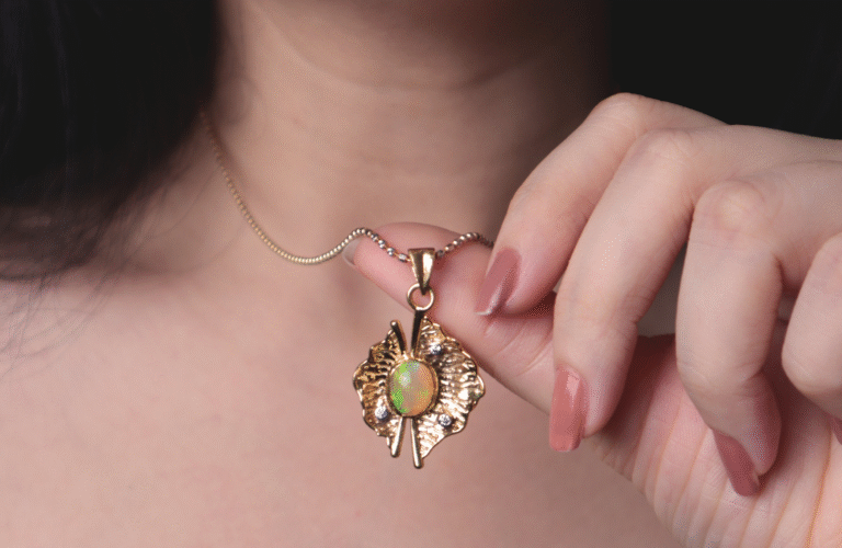 A woman holding a gold necklace with a unique gemstone pendant, symbolizing elegance and luxury — perfect to complement Unique Gemstone Rings for Diwali Gifting in India.